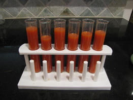test tubes filled with tomato blood soup